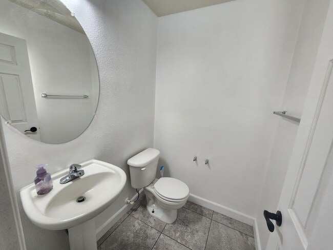 Building Photo - Sleek 2 story home with tile in most living areas and upgraded kitchen.