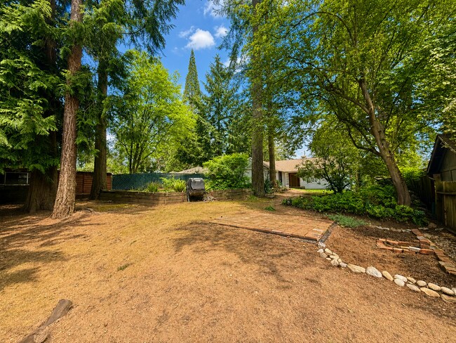 Building Photo - Sunlit Park-Like 1937 Shoreline Charmer in Lush Garden Oasis