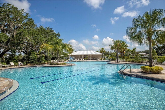 Building Photo - Open Floor Plan! Nice corner lakefront home!  Community pool, playground and walking trails.