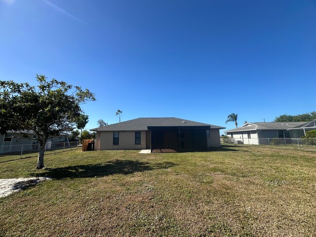 Building Photo - Fenced 3/2 with Screened Lanai in NE Cape Coral