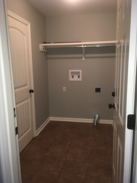 Utility Room w/ shelving - 108 Smalley Rd