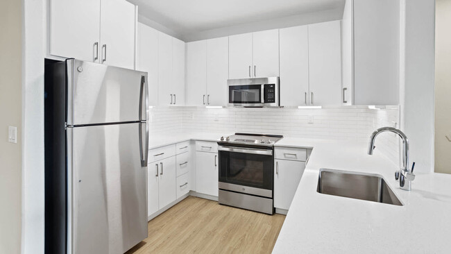 Kitchen with Stainless Steel Appliances - Estancia at Santa Clara