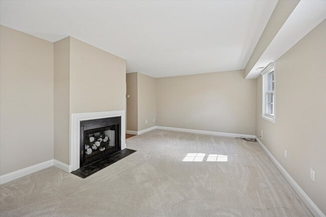 Building Photo - Available Immediately – 4 Bedroom End-Unit...