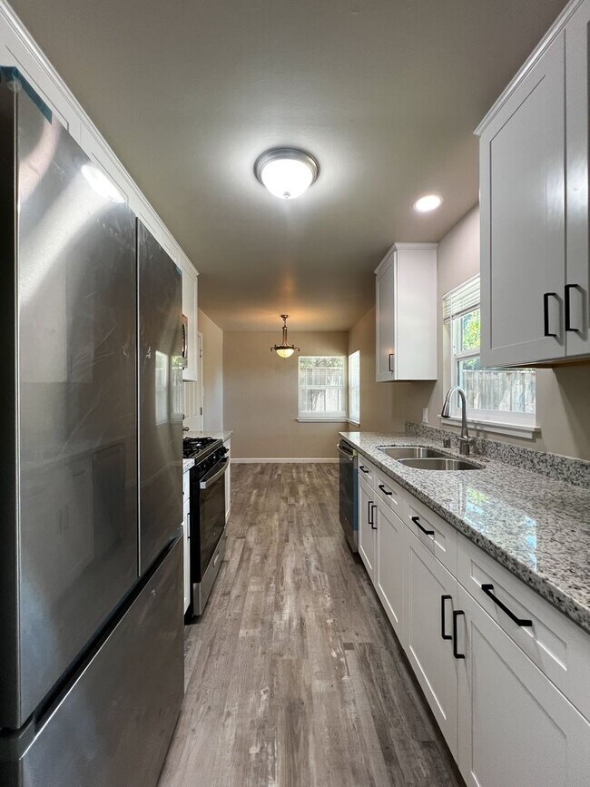 Building Photo - Freshly Renovated 3 Bedroom Home with Large Fenced Yard & Double Garage
