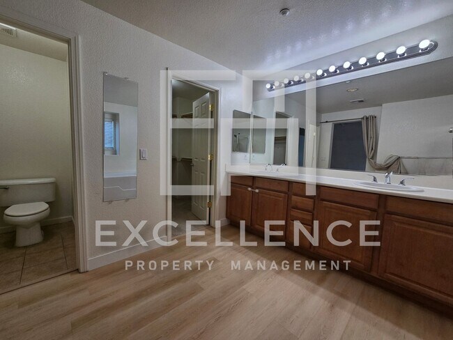 Building Photo - Spacious 3/2.5 Located In Communication Hills, With Two 1 Car Garages, W/D & Large Master Retreat