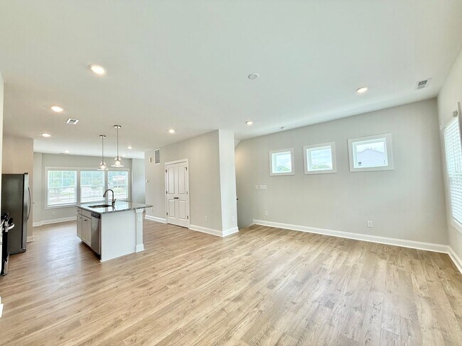 Building Photo - Stunning End Unit New Construction 3BD, 3....