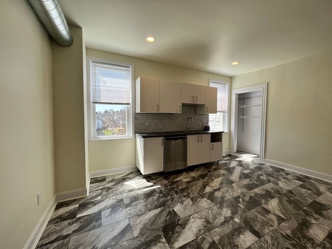 Building Photo - Updated 3BR house with multi-car off street parking!