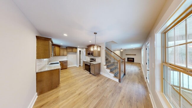 Building Photo - Beautifully Upgraded Home | Stone Fireplace, Open Kitchen and Two-Car Garage