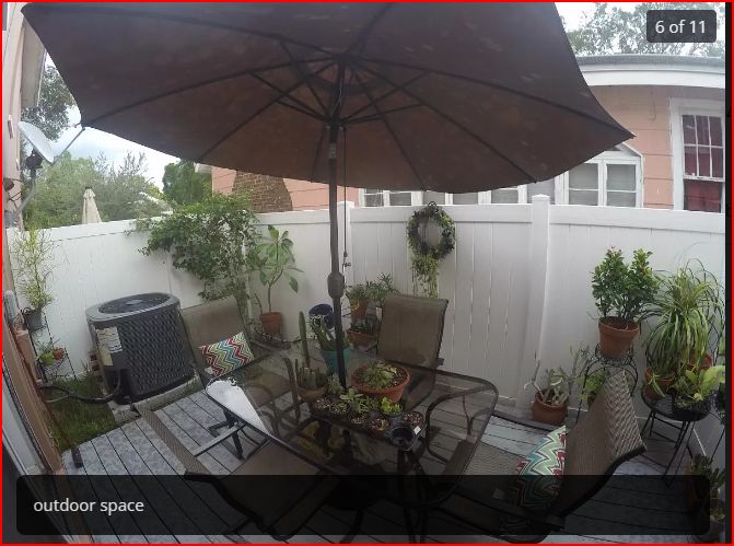 Fenced in deck with sliding glass doors off kitchen - 303 S Bungalow Park Ave