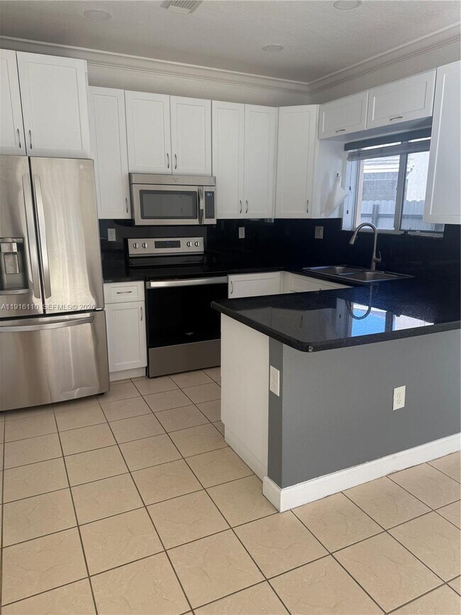 Building Photo - 3102 NE 3rd Dr