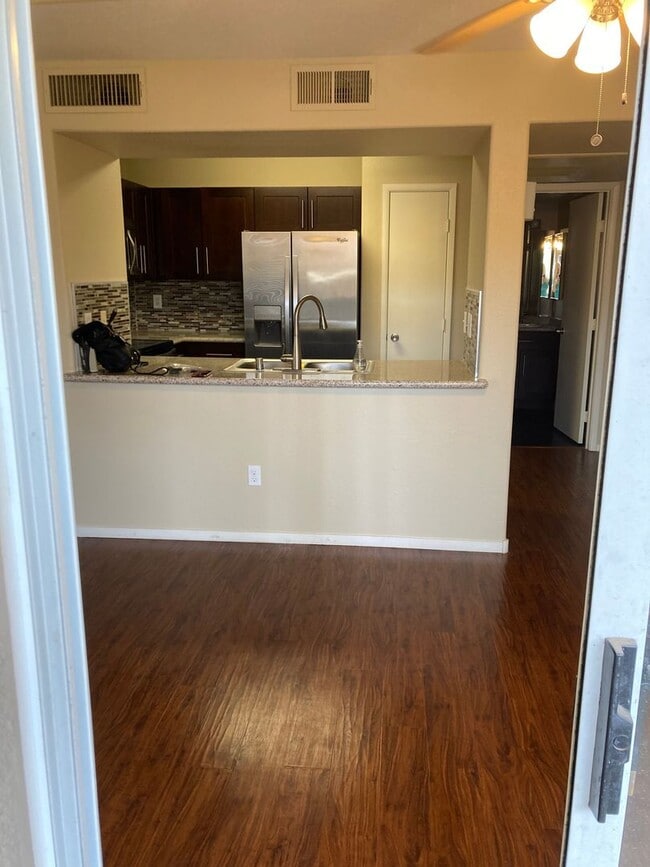 Building Photo - Gated community just minutes south of the strip, 2br/2bath, 2nd floor condo.