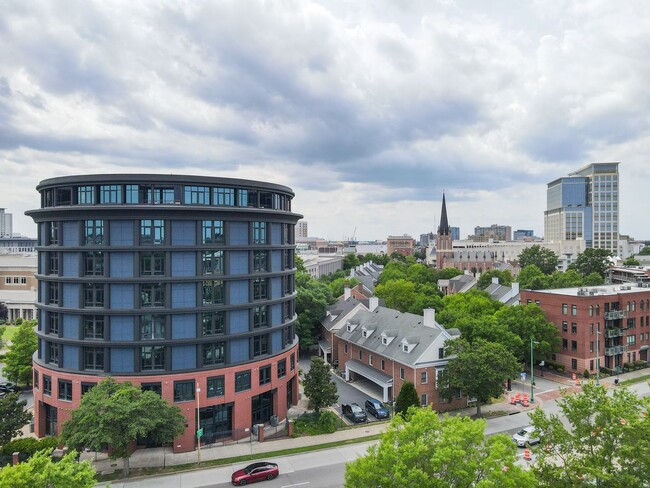 Building Photo - Industrial-Themed Mid-Rise, One-Level Cond...