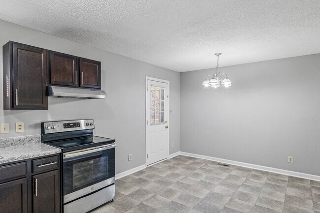 Building Photo - NE Home - Updated Kitchen and Bathrooms!  SS Appliances, Fire Place, Front Porch & Deck, Fenced Y...