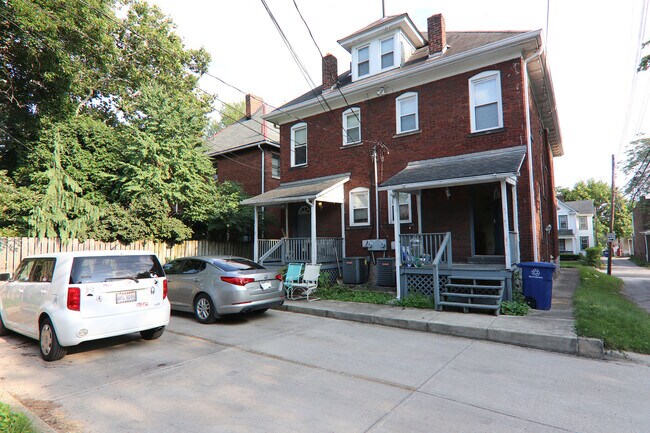 View of the the back of the rear side of house with parking lot - 372 E Oakland Ave