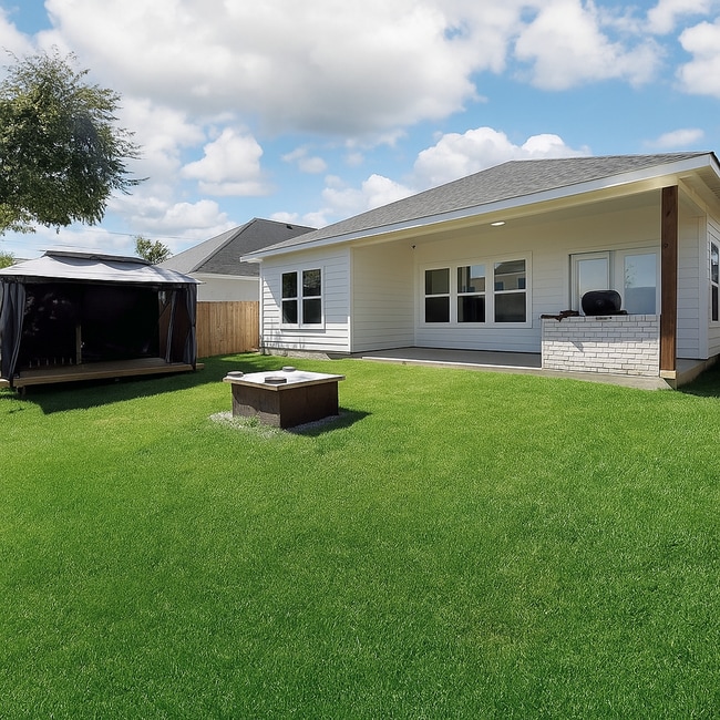 Building Photo - Modern 4-Bedroom Retreat with Patio Deck &...