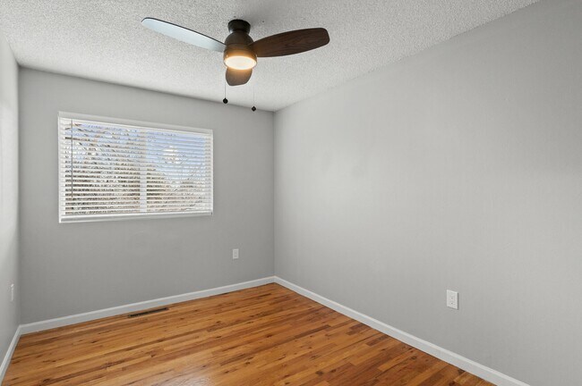 Experience the tranquility of this bright and airy bedroom, perfect for relaxation. - 5580 West 4th Avenue Townhomes