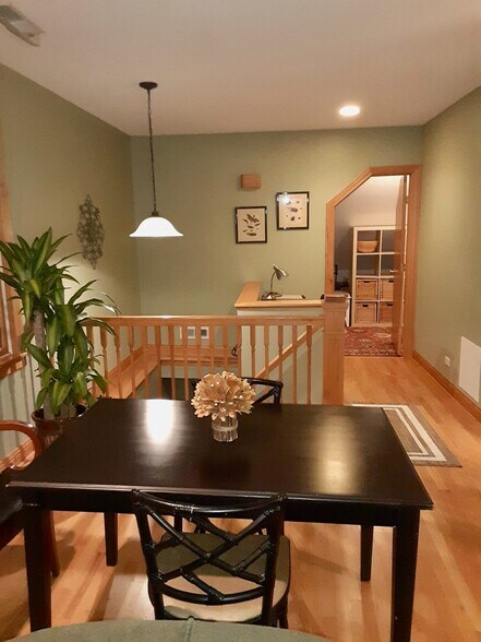 From Couch Looking to table, entrance , desk and changing room - 2422 N Drake Ave