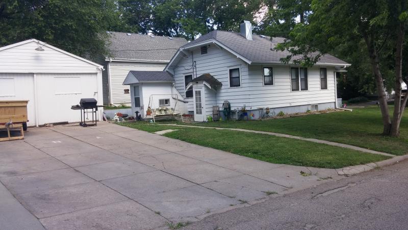 Rear entry of house offers walkout basement and entry into home. - 2024 Central Ave