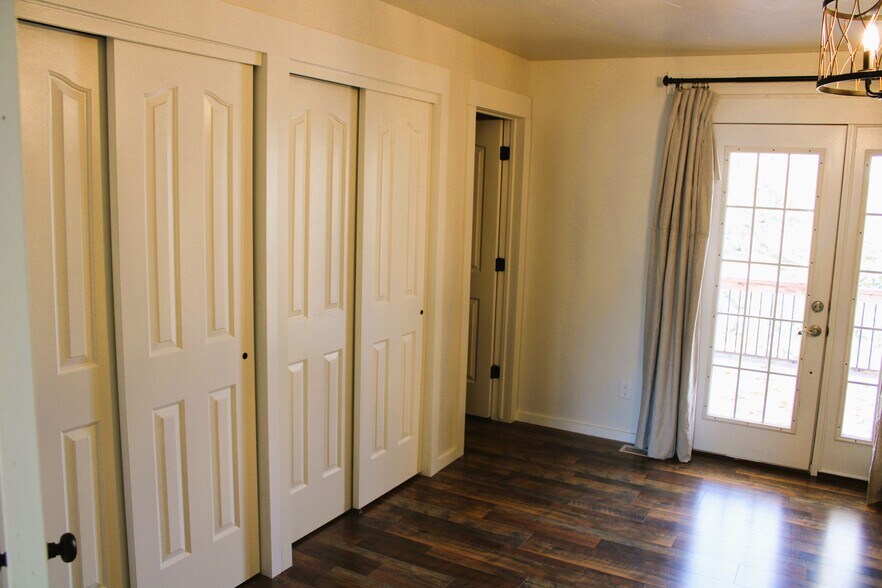 Master bedroom with French doors and upper level deck - 11380 W Montana St