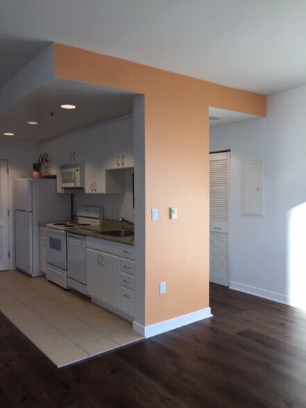 Kitchen and hallway to the bathroom from living room. - 250 King St