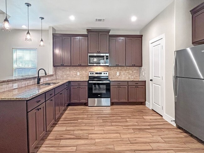 Building Photo - Elegant Stone-Front Home on 1 Acre in Natalia