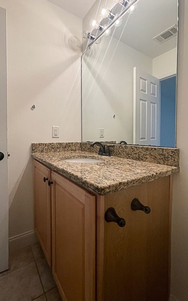 Building Photo - Three Bedroom House with Gated Backyard