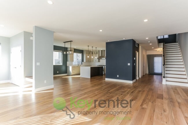 Building Photo - Spacious Living with Balconies, Deck, and Private Yard
