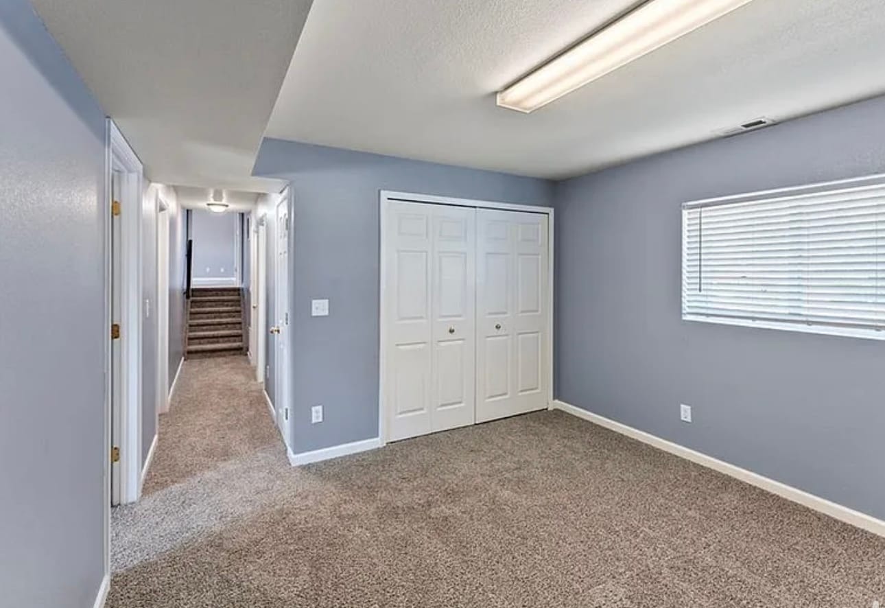 Family space facing shared laundry machine closet - 7390 Sue Ln