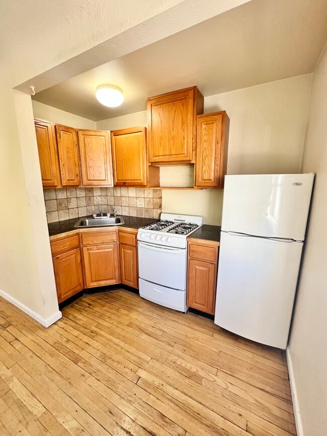 Experience efficient living with this cozy kitchen setup, perfect for culinary adventures. - Hillside Apartments