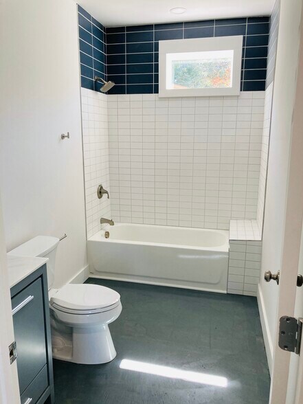 Tub and Ceramic Tile surround in Hall Bath with plenty of room for Bathtime! - 1311 Blair St