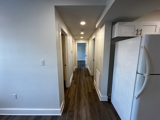 Hallway to bedrooms/utility room - 3300 Nashville Ave