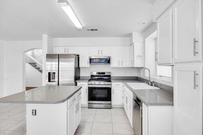 Building Photo - SE!!  Windmill and 215!! Newly remodeled!! All Tile Floors down stairs!! Low Maintenance Desert L...