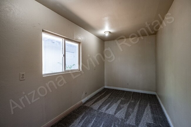 Building Photo - LARGE FENCED YARD WITH DETACHED GARAGE