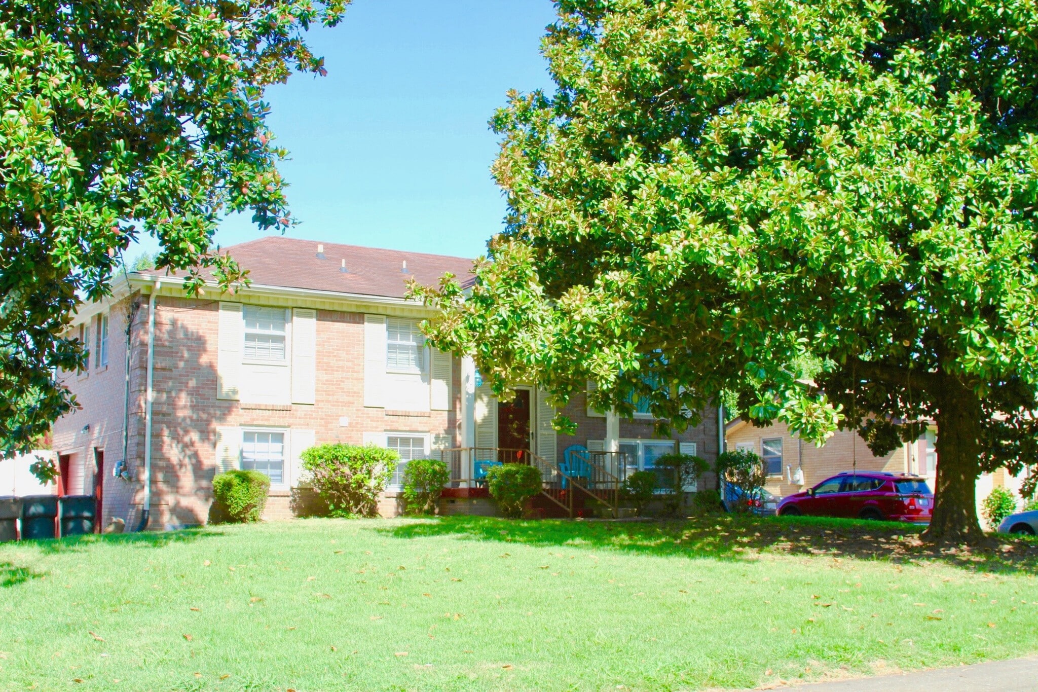 Gorgeous Magnolia Trees and swing out front. - 4807 Jeffery Dr