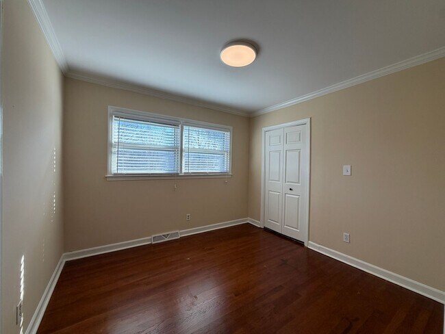 Building Photo - Freshly Painted Split-Level Home with Large Deck & Lawn Care Included