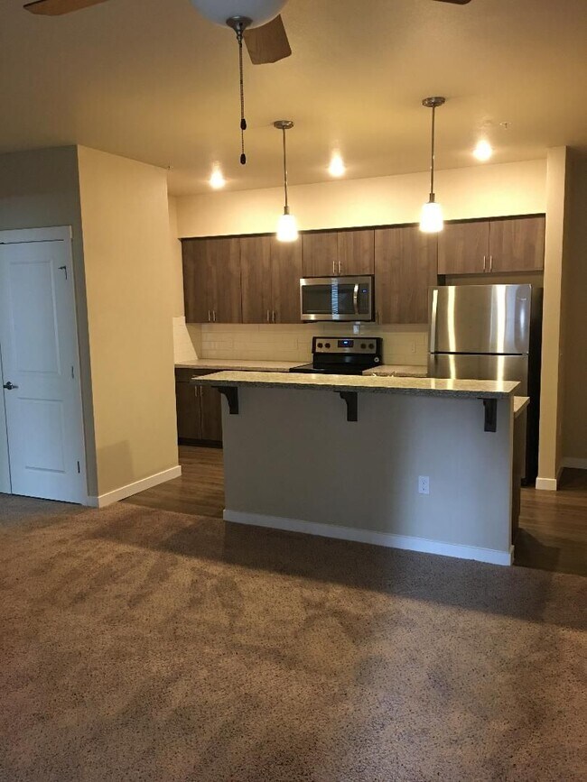 Building Photo - Stunning 1-Bedroom with Upscale Interiors & Open Island Kitchen!