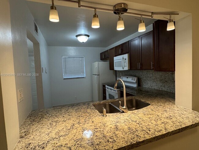 Building Photo - 3022 Coral Springs Dr