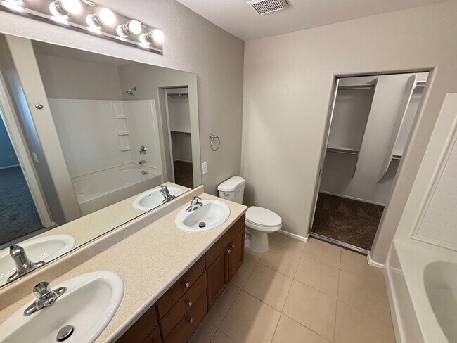 Building Photo - Spacious Tri-Level 4-Bedroom Home with Bal...