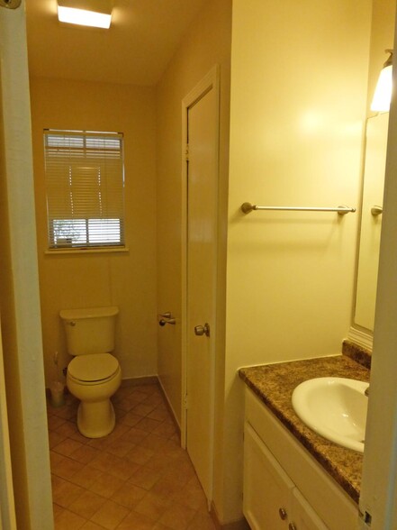 Hall bath has tile floor, utility closet - 55 Beech Hills