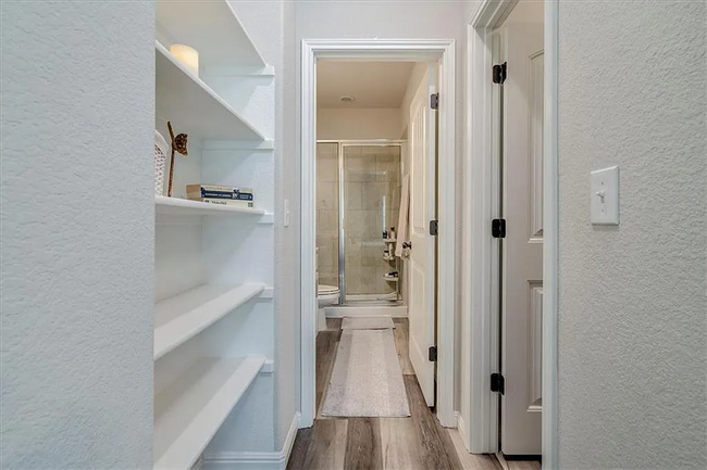 Closet and Shelves in Primary Bedroom - 7300 Haggard Dr