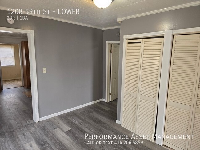 Building Photo - Charming 2-Bedroom Lower Unit Available 1/...