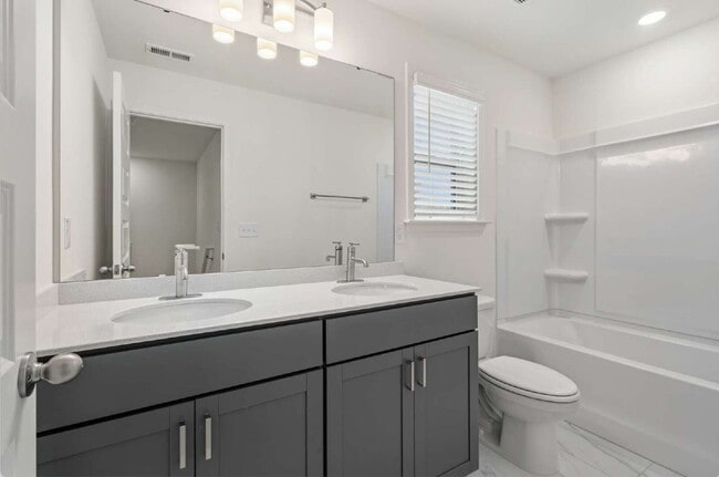 Building Photo - Spacious 3-Bed Townhouse w/ Two Car Garage