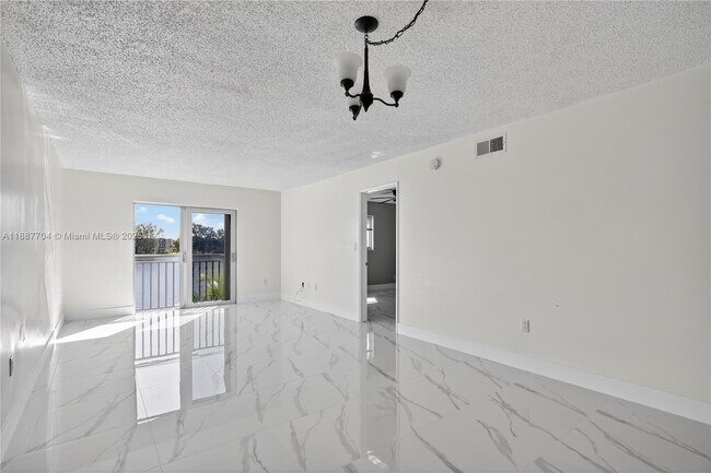 Building Photo - 9915 W Okeechobee Rd