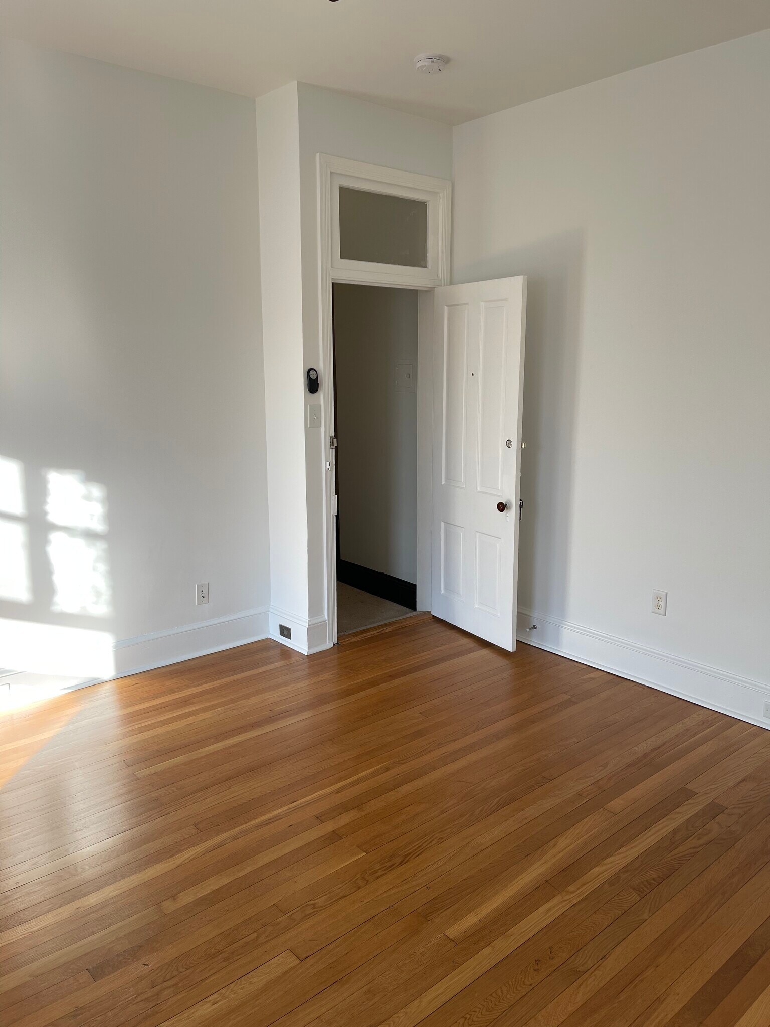 Living Room looking at front door - 105 W 3rd St