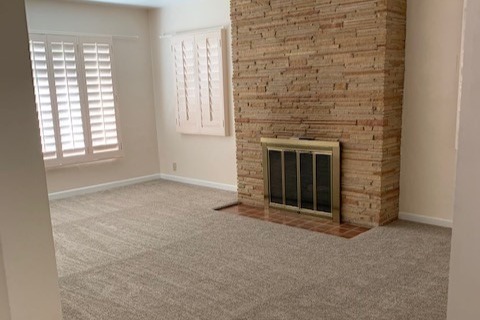 living room w/ fireplace - 6727 N 13th Pl
