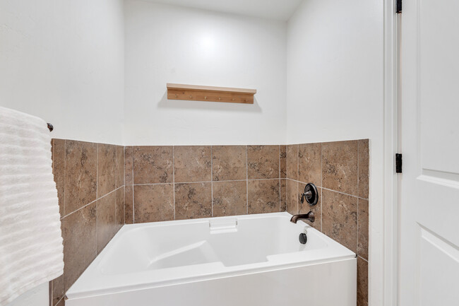 Large soaker tub with handrails in master bath - 10441 S Sage Vista Way