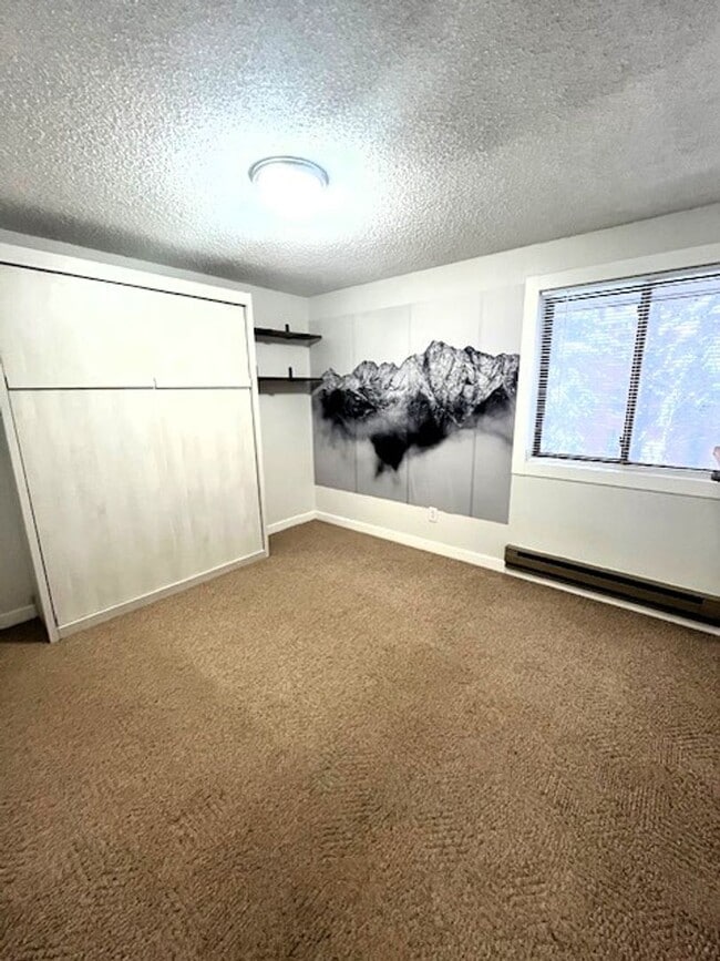 Building Photo - Long Term Rental- Creekside Condominiums #20C - UNFURNISHED