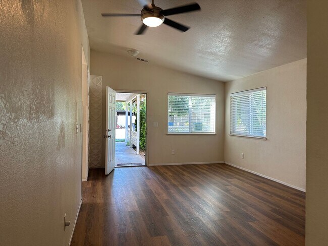 Building Photo - Charming Redding Home with Fireplace & Vau...