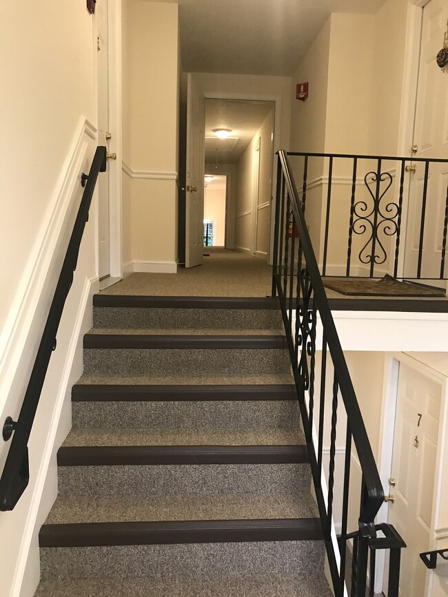 1.5 small flights of stairs to end unit facing parking lot - 13 Summer St