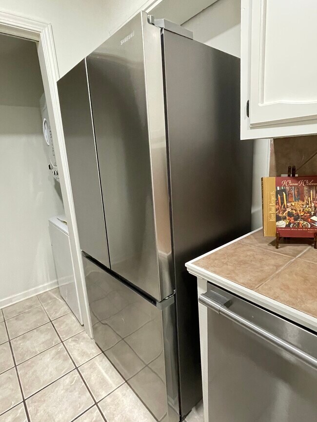 New refrigerator with ice maker and adjacent dishwasher - 12447 Coursey Blvd